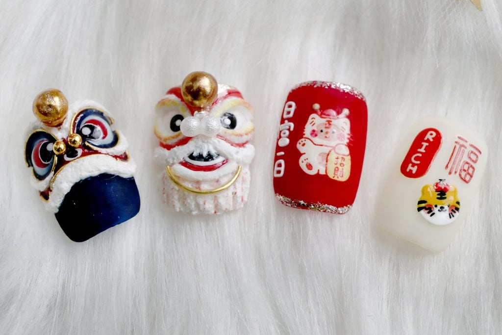 霹:20日见报/封底主文/【乐活频道】/新年美甲.应节Q版小老虎跃指尖萌萌哒