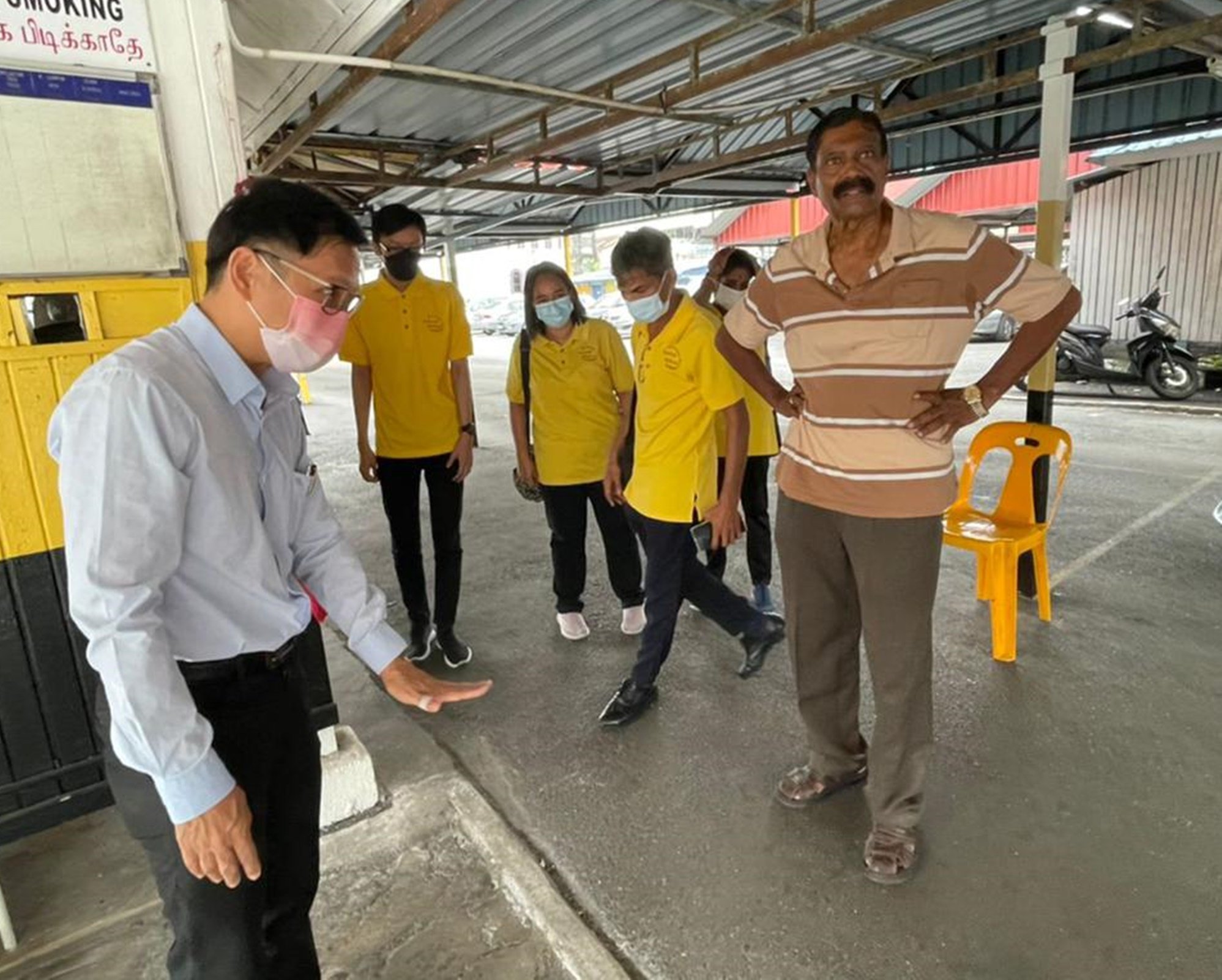 廖泰义助提升德士总站路路面水平除积水