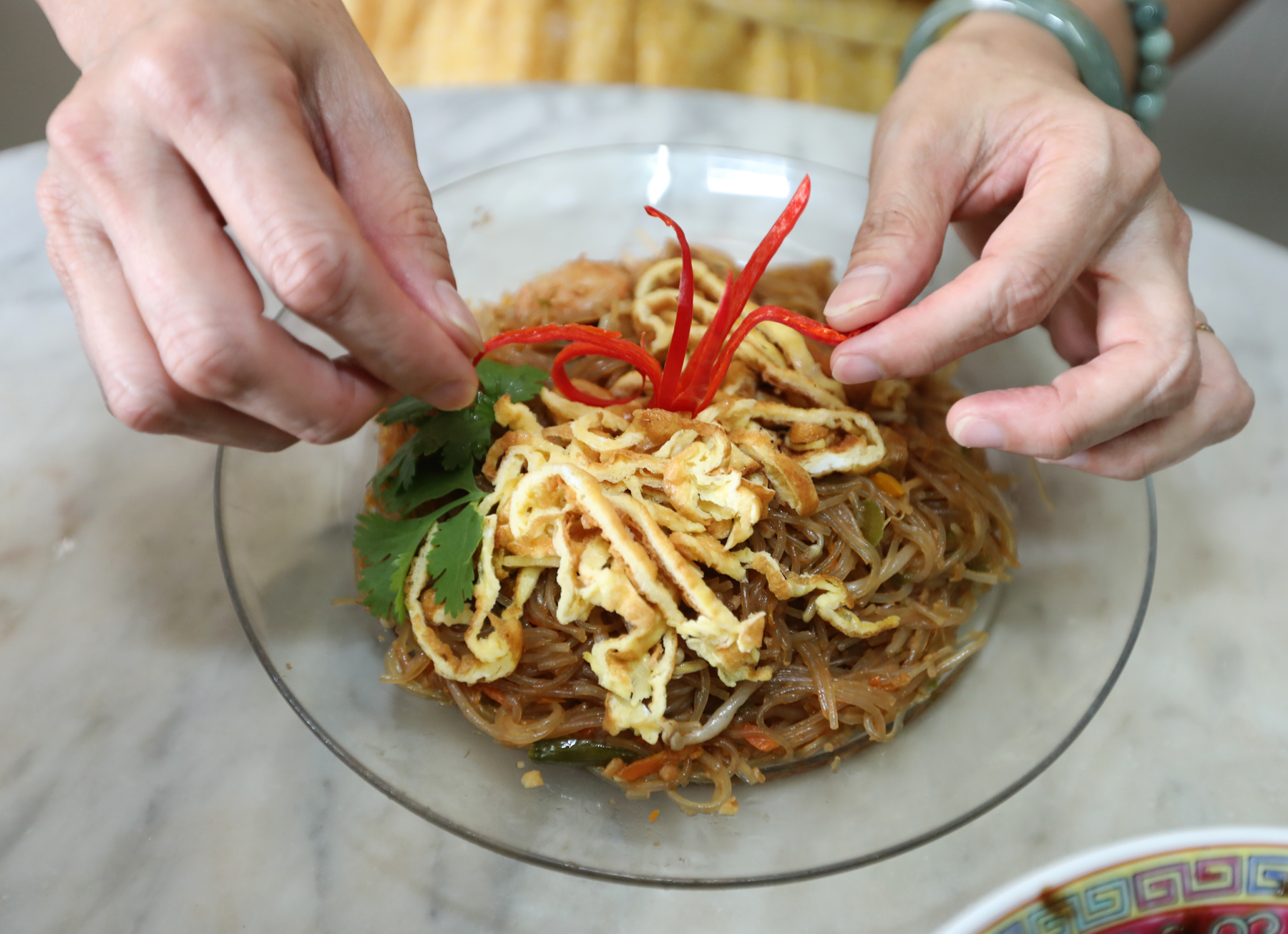 郭美丽传承前人手艺,自小学习不同传统风味菜肴