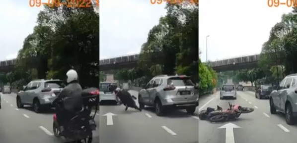 小贩路边兜售成意外导火线 摩托骑士闪轿车被撞后逃