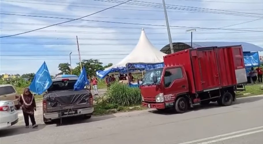 **已签发**国:挂国阵旗帐篷叫卖“买鸡免费白米”,潘伟斯指王晓庭违选举法