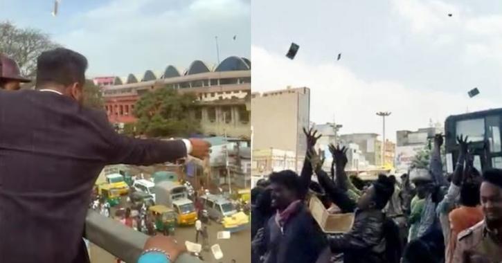 印度男子桥上洒钱 民众争拾交通大乱