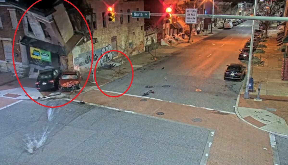 轿车逃追捕撞公寓楼 二楼垮塌砖块埋车