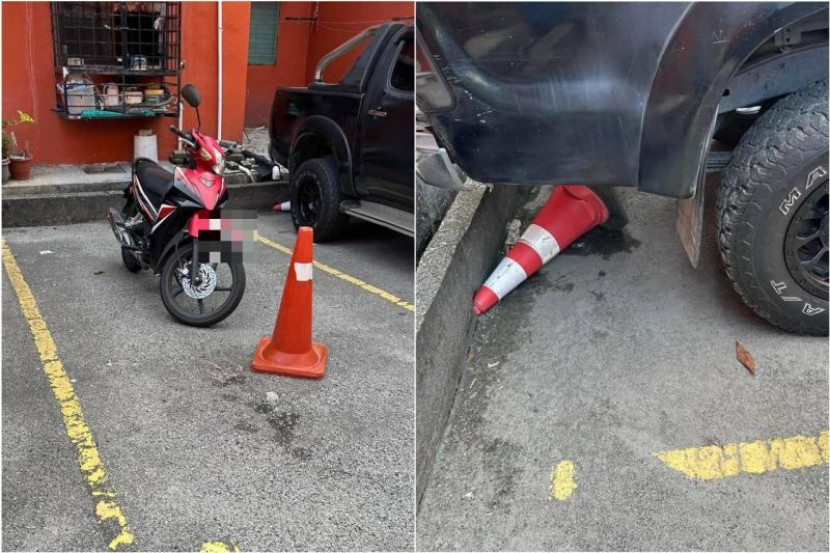 不满组屋居民霸停车位 司机直接碾破交通锥