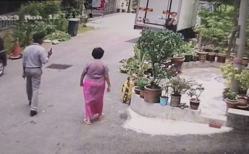 身份不明男子指示华妇撤走栽种屋前花树,并拍视频上载社媒,华妇儿子不明居心何在