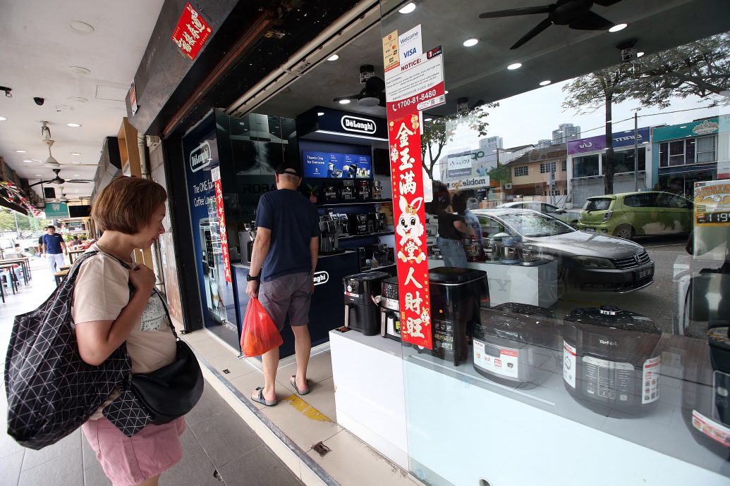 大都会/封面/烘干机 雨季受落 洗衣店生意飙升