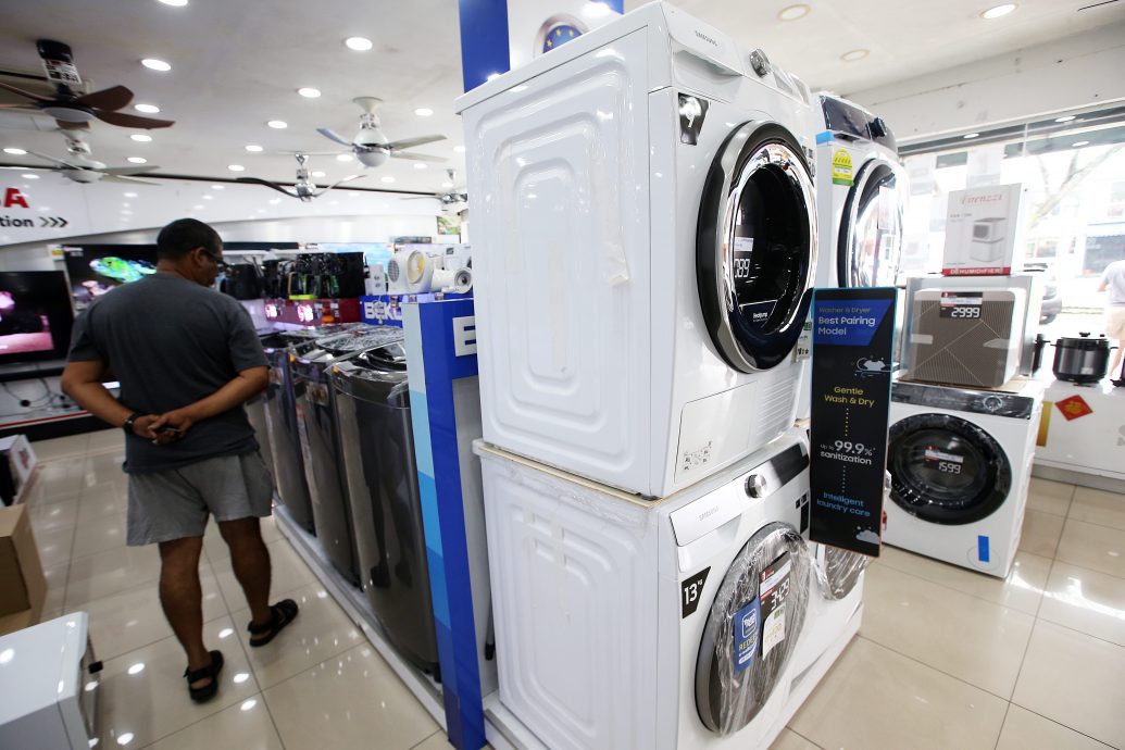 大都会/封面/烘干机 雨季受落 洗衣店生意飙升