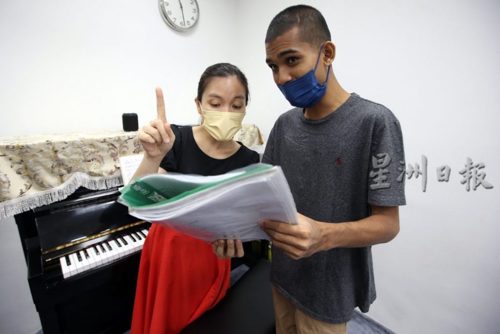 新教育（4月11日）封面故事：大马自闭症协会合唱团[摄影组] 黄安健