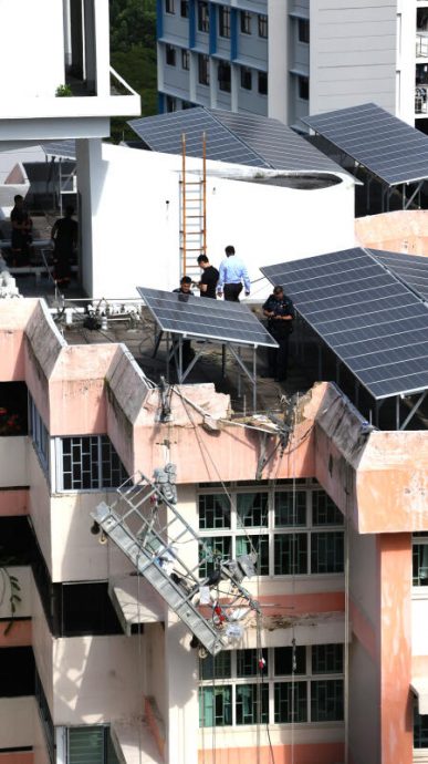 (已签发)柔:狮城二三事:墙塌吊架倾斜 2客工挂15楼爬窗入屋及时逃