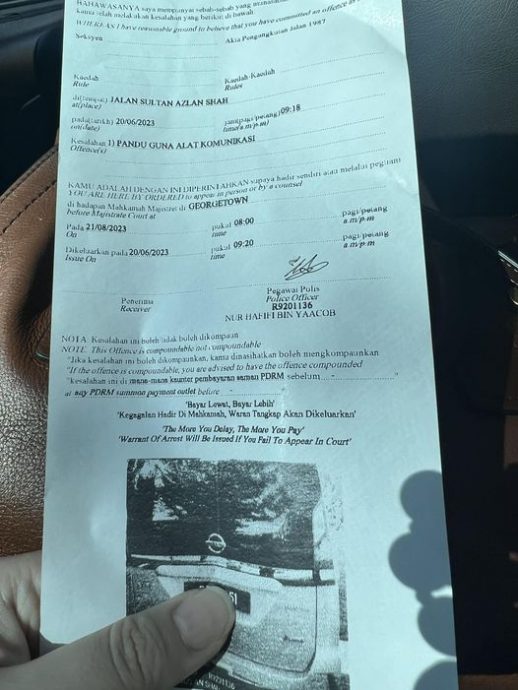 刚到槟城看waze被罚1千 女子:手机放腿上也不行