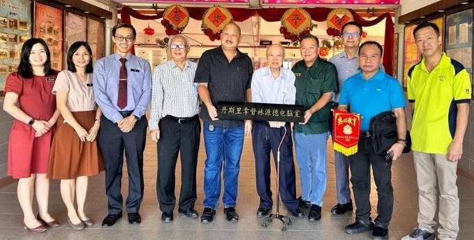 霹/林源德捐15万助育才华小发展