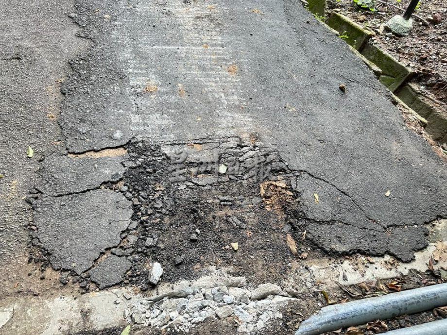 (古城封面主文)熊山登山好去处 柏油路破损危及登山客