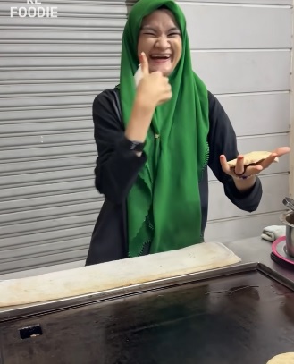 视频|残疾女自力更生卖汉堡 网民力赞:太棒!