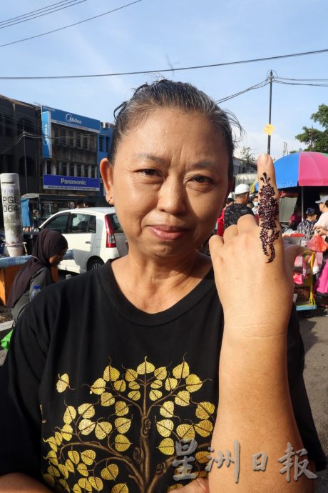 柔:【特稿】: 屠妖节 战胜黑暗迎光明 彩绘 姆鲁古 拉近各族联系