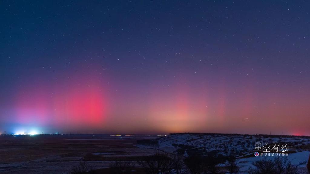 中北方多地上演极光秀  “神州北极”漠河红绿交织 