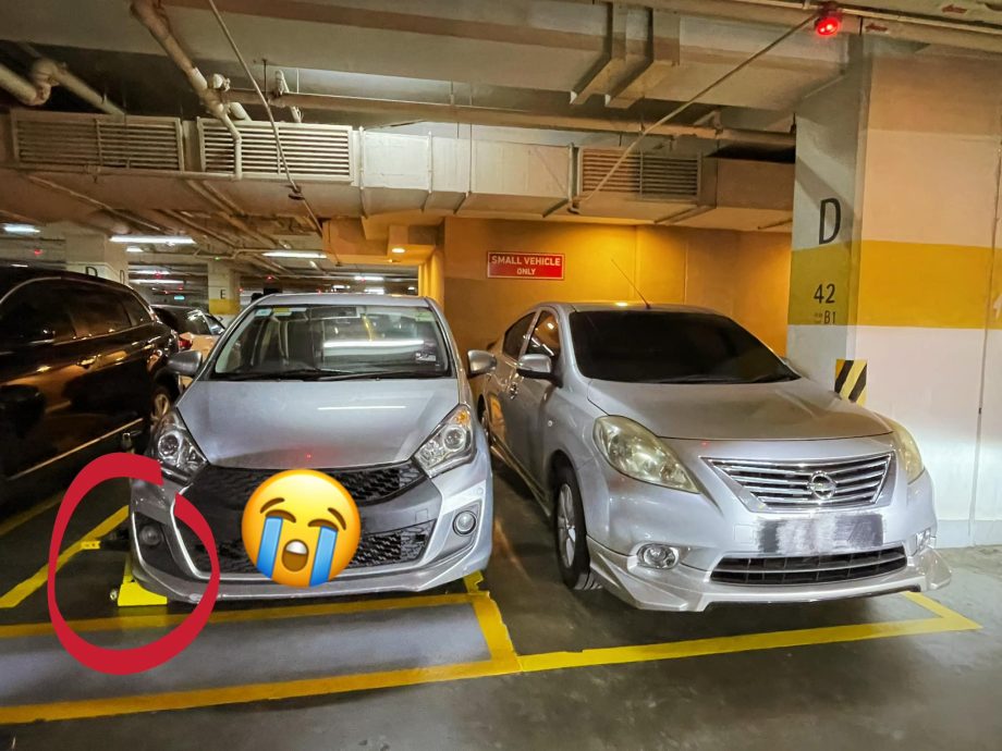 商场泊车压到线被锁车轮！女主播：泊车费变RM74好心痛