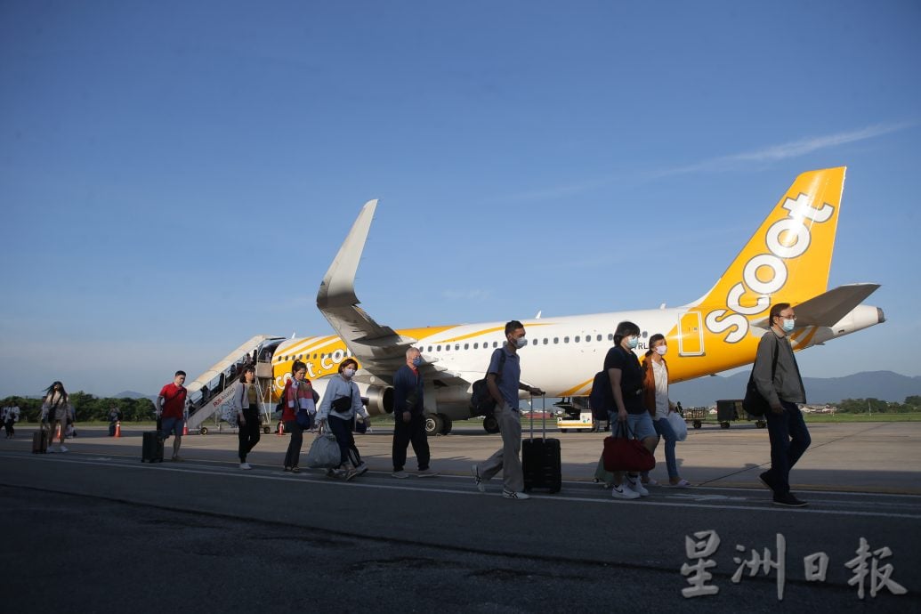 霹2024旅游年启动  怡机场洒水礼迎新年首趟乘客