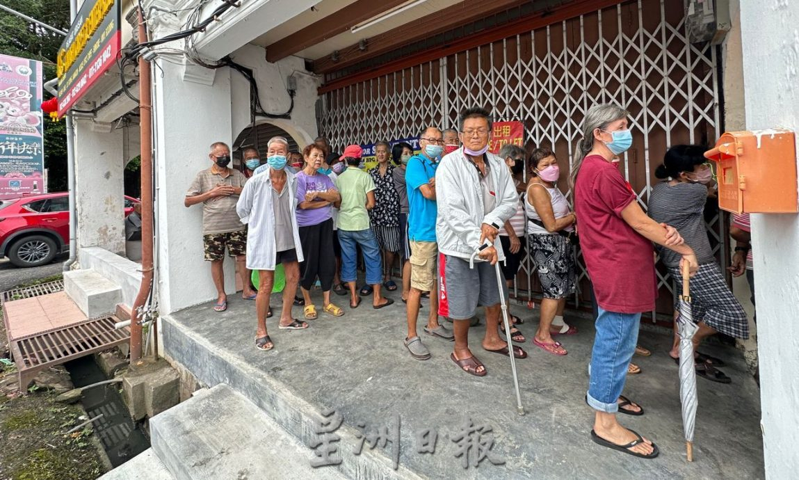 (古城第七版主文)65人领取红包爱心餐过年 感受社会温情