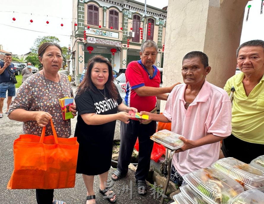 (古城第七版主文)65人领取红包爱心餐过年 感受社会温情