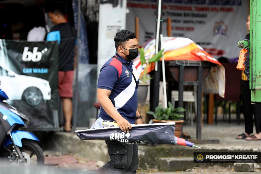 大都会/市政局情人节突击取缔非法洗车中心和熟食摊