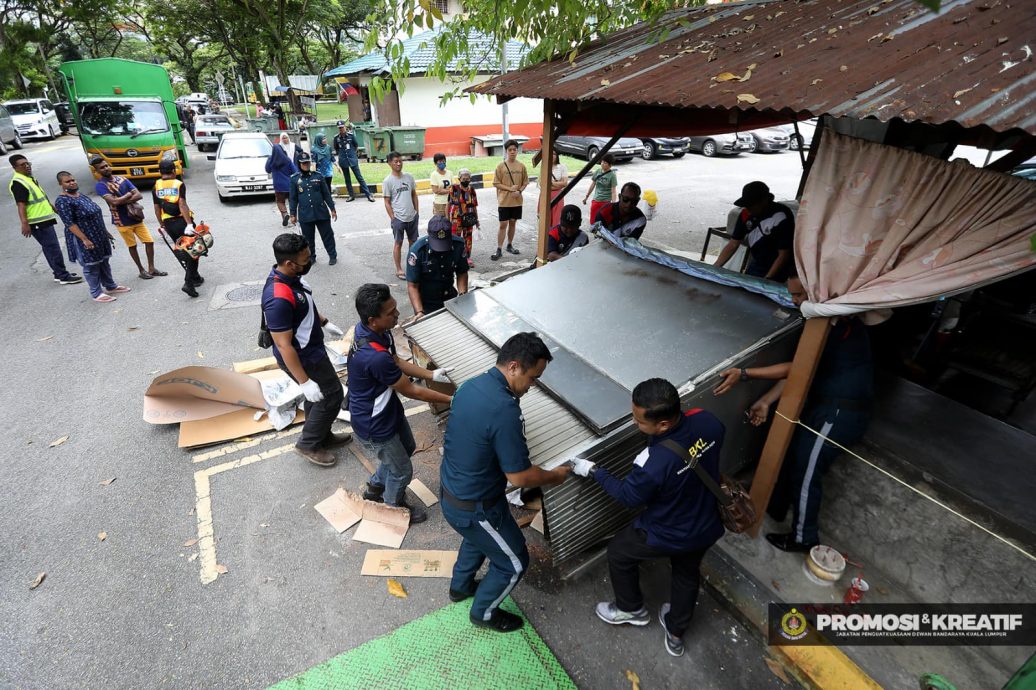 大都会/市政局情人节突击取缔非法洗车中心和熟食摊