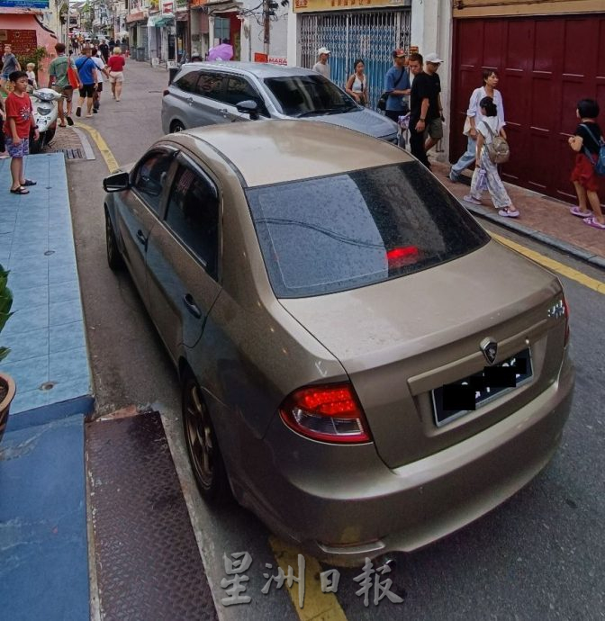 (古城封面主文)吉灵街商家发动签名要求恢复交通