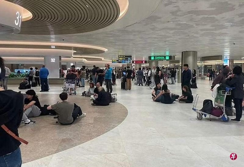 *已签发*柔:狮城二三事:狮城多地下大雨 班机延误领行李等2小时