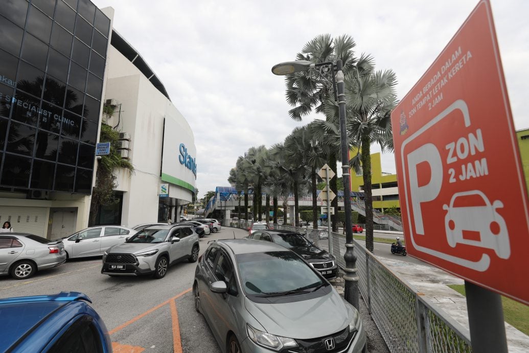 大都会:走访灵市52区商业区限时停车2小时措施