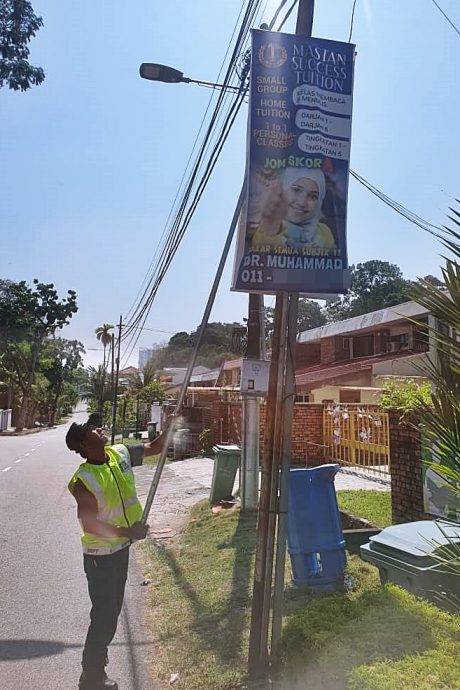 封面副文(大北马)陈淑湘:取消电话号码 对付非法广告牌商家