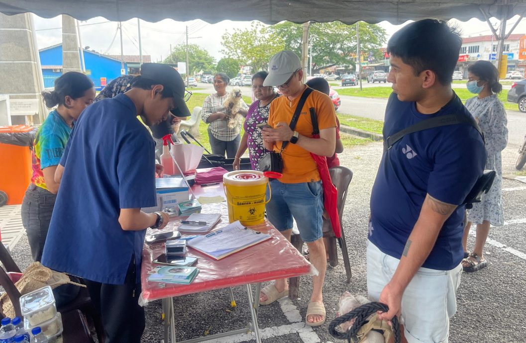 me03副文-大都会/巴生市厅在卫星市为81只狗发放狗牌/5图