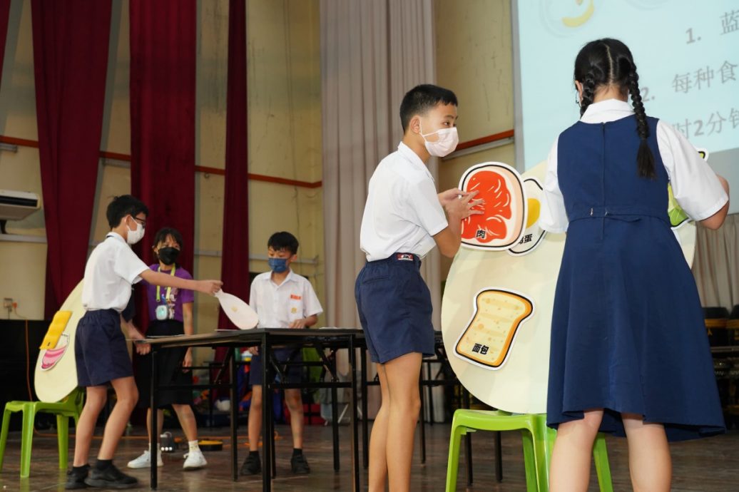 p2 霹/版头/“均衡营养从早餐开始” 育才华小学生乐中学