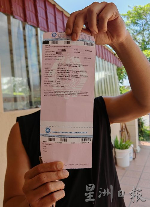 (古城封面主文)市民用Melaka Smart Parking缴付停车费依然被开罚单