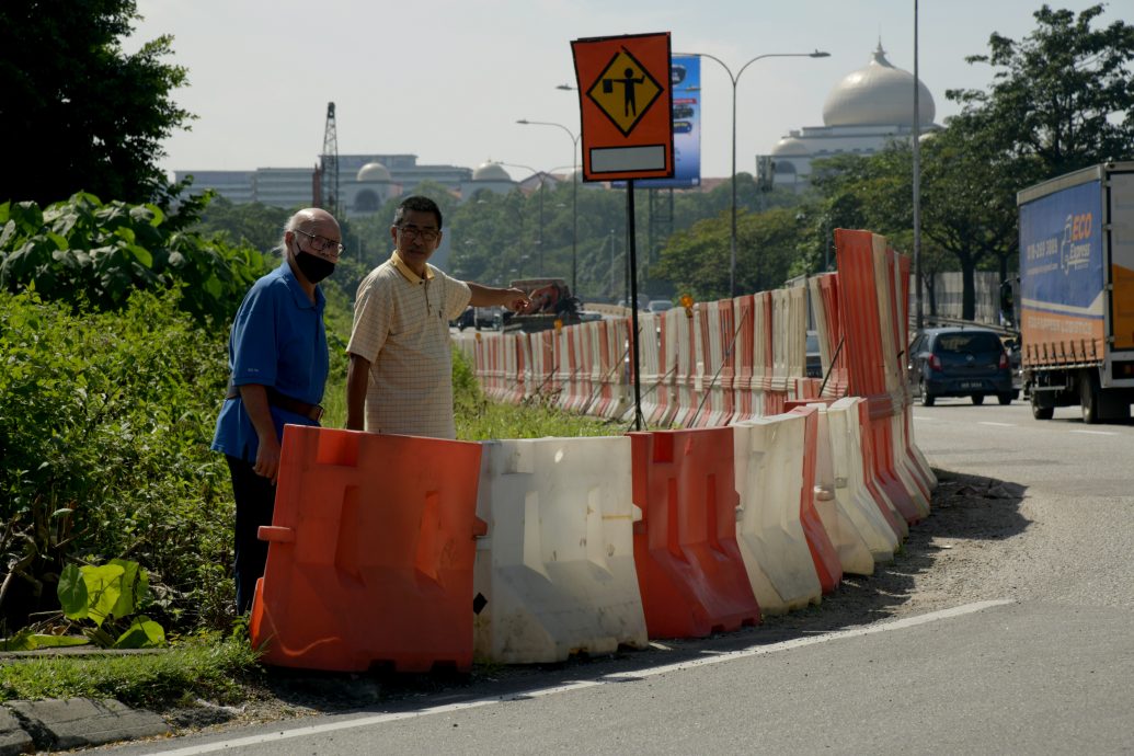 版头-大都会/余保凭与本报读者投诉古晋路道路危险问题/8图