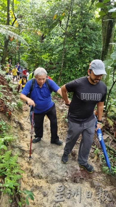 版头//大都会/Go Go Hiking带领视障人士登山，2小时完成3.9公里的登山挑战