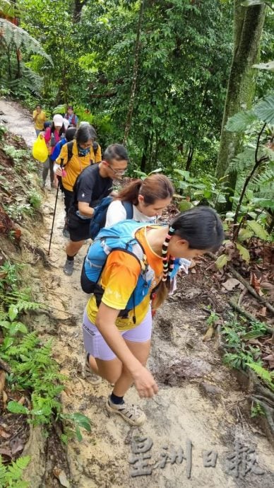 版头//大都会/Go Go Hiking带领视障人士登山，2小时完成3.9公里的登山挑战