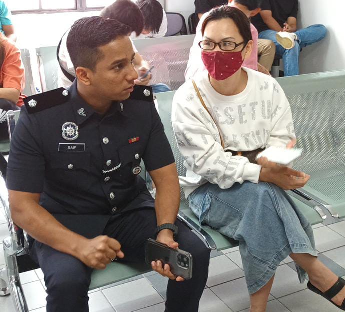 *已签发*全国：警方调阅监控器发现女子不在场 狮城女报假案罚1千