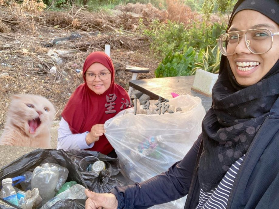  主文///暖势力:巫裔家长带领孩子支持华校资源回收计划。