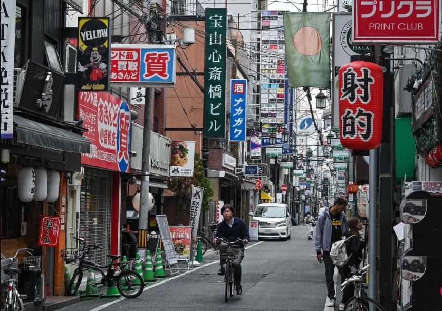 拚图)日本明年起对违规骑行开罚单
