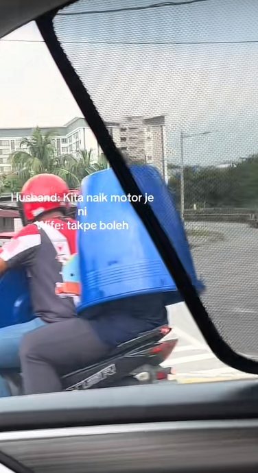 骑摩托车买桶无处放?妻子身体套桶引热议