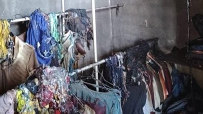 双层排屋房间失火 . 一家4口及时逃
