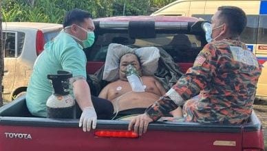 体重上百斤. 消拯员用货卡护送病患就医
