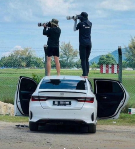  两名摄影师站车顶拍照 出租车业者发文谴责