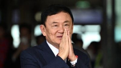 泰国前首相塔辛保外就医遭质疑  佩通坦为父辩护
