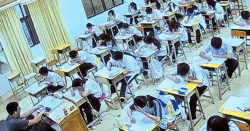 看世界)中国高考出动AI监考 违规行为“无处遁形”