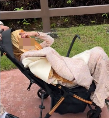 视频|拍外景太累还是懒惰走路？ 新娘坐婴儿车有苦衷