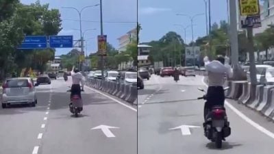 视频| 骑行途中突站立高举双手 网惊呼：她经常这样做！