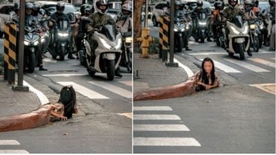 马尼拉闹市 一女子从排水道爬出 “惊悚画面”引热