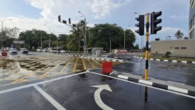 巴当知甲妮华娜花园 | 告示牌不清晰 指挥箭头引混淆   十字路口交通灯 惹议