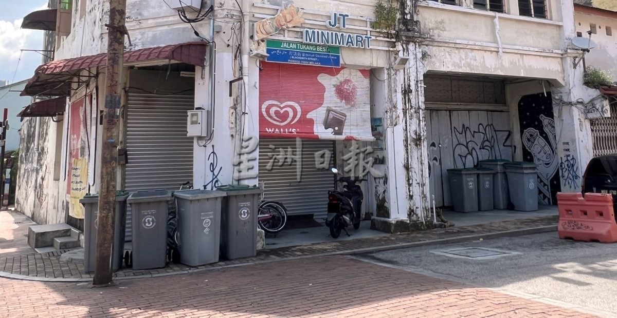 （古城封面主文）照片中的不速之客·老街垃圾桶应被赋予新面貌