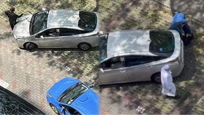 疑与电召司机闹停车纠纷 女司机肉身挡车被压在地